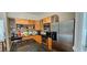 Functional kitchen with stainless steel appliances, an island, and wooden cabinets at 4965 N Bridges Dr, Alpharetta, GA 30022