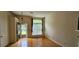 Cozy living room with hardwood floors, a large window, and outdoor access at 4965 N Bridges Dr, Alpharetta, GA 30022