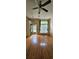 Bright living room with shiny hardwood floors and a ceiling fan at 4965 N Bridges Dr, Alpharetta, GA 30022