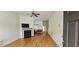 Spacious living room with hardwood floors, a fireplace, and a ceiling fan at 4965 N Bridges Dr, Alpharetta, GA 30022