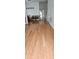 Inviting living room featuring shiny hardwood floors and a neutral color palette at 4965 N Bridges Dr, Alpharetta, GA 30022
