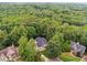 Aerial view of a beautiful home situated among lush green trees at 827 Holly Rdg, Canton, GA 30115