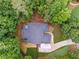 Aerial view of house showing the rooftop, driveway, grassy yard, and green trees surrounding the property at 827 Holly Rdg, Canton, GA 30115