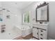 Modern bathroom featuring a separate tub and shower, as well as a stylish vanity with lots of storage at 827 Holly Rdg, Canton, GA 30115