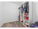 Walk in closet featuring organized shelving with ample storage for clothing, shoes, and accessories at 827 Holly Rdg, Canton, GA 30115