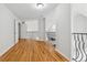 Hallway with hardwood flooring and metal railings with wrought iron balusters at 827 Holly Rdg, Canton, GA 30115