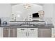 Modern kitchen featuring stainless steel appliances and granite countertops with views to a relaxing living space at 827 Holly Rdg, Canton, GA 30115