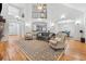 Spacious living room with high ceilings, hardwood floors, and a large decorative rug at 827 Holly Rdg, Canton, GA 30115