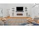 Comfortable living room with fireplace, hardwood floors, and large windows at 827 Holly Rdg, Canton, GA 30115