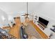 Bright living room with hardwood floors, fireplace, ceiling fan, and vaulted ceilings at 827 Holly Rdg, Canton, GA 30115