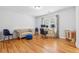 Home office with hardwood floors, natural light, neutral colors, a couch and desk area at 827 Holly Rdg, Canton, GA 30115