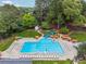 Aerial view of the community pool, complete with slides, umbrellas, and seating at 827 Holly Rdg, Canton, GA 30115
