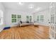 Cozy sitting room with hardwood floors, natural light, and comfortable seating at 827 Holly Rdg, Canton, GA 30115