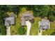 Expansive aerial view showcases lush landscaping, mature trees, and charming home exterior at 1275 Kelly Nelson Dr, Lawrenceville, GA 30043