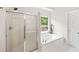 Corner bathtub next to shower at 1275 Kelly Nelson Dr, Lawrenceville, GA 30043