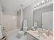 Clean bathroom with shower-tub combination, vanity, and ample lighting at 1275 Kelly Nelson Dr, Lawrenceville, GA 30043