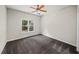 Bedroom with a colorful ceiling fan, neutral walls, carpeting and a window for natural light at 1275 Kelly Nelson Dr, Lawrenceville, GA 30043
