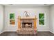 Living room featuring a stone fireplace with a wood mantel at 1275 Kelly Nelson Dr, Lawrenceville, GA 30043