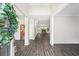 Spacious open-concept foyer with wood-look floors, leading to the living spaces at 1275 Kelly Nelson Dr, Lawrenceville, GA 30043