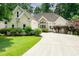 Charming one story home featuring manicured lawn and attractive stone accents near the front entrance at 1275 Kelly Nelson Dr, Lawrenceville, GA 30043