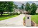 Well-maintained one story home boasting lush landscaping, a long driveway, and craftsman architectural details at 1275 Kelly Nelson Dr, Lawrenceville, GA 30043