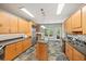 Open kitchen with stainless steel refrigerator, island, granite countertops, and backyard access at 1275 Kelly Nelson Dr, Lawrenceville, GA 30043