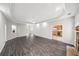 Spacious living room with hardwood floors, fireplace, and modern ceiling fan and lights at 1275 Kelly Nelson Dr, Lawrenceville, GA 30043
