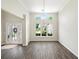 Sunny living room with vaulted ceiling, windows and wood-look floors at 1275 Kelly Nelson Dr, Lawrenceville, GA 30043