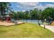 Community playground area with slide, mulch, and tennis court at 1275 Kelly Nelson Dr, Lawrenceville, GA 30043