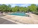 Community pool with ample seating and well-maintained landscaping at 1275 Kelly Nelson Dr, Lawrenceville, GA 30043