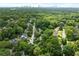 Panoramic aerial shot of lush greenery stretching towards the skyline of the city at 2054 Palifox Ne Dr, Atlanta, GA 30307