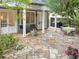 Inviting back patio with stone flooring, outdoor furniture, and lush greenery, perfect for entertaining and relaxing at 2054 Palifox Ne Dr, Atlanta, GA 30307