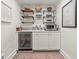 Chic bar area featuring a wine fridge, countertop, and decorative shelving at 2054 Palifox Ne Dr, Atlanta, GA 30307