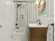 Updated bathroom with white subway tile shower, decorative mirror, and bronze fixtures for a classic touch at 2054 Palifox Ne Dr, Atlanta, GA 30307