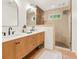 Modern bathroom features dual vanities, a glass-enclosed shower, and stylish fixtures at 2054 Palifox Ne Dr, Atlanta, GA 30307