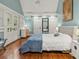 Bright bedroom with French doors, hardwood floors, and stylish furnishings at 2054 Palifox Ne Dr, Atlanta, GA 30307