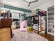 Whimsical bedroom featuring a lofted bed, plush rug, and abundant shelving perfect for a young resident at 2054 Palifox Ne Dr, Atlanta, GA 30307