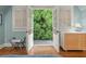 Bedroom with french doors leading to a balcony overlooking lush greenery at 2054 Palifox Ne Dr, Atlanta, GA 30307