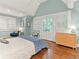 Comfortable bedroom with ample natural light, French doors, and a charming sitting area at 2054 Palifox Ne Dr, Atlanta, GA 30307
