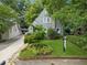 The home is set on a well manicured lot with lush landscaping and traditional design elements at 2054 Palifox Ne Dr, Atlanta, GA 30307