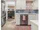 Cozy kitchen with stainless steel fridge and view into the living space at 2054 Palifox Ne Dr, Atlanta, GA 30307