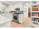 Bright kitchen with stainless steel appliances and view to the dining room at 2054 Palifox Ne Dr, Atlanta, GA 30307