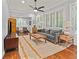 Cozy living room with hardwood floors, large windows, and comfortable seating at 2054 Palifox Ne Dr, Atlanta, GA 30307