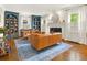 Cozy living room with a charming fireplace and an inviting sitting area, complemented by built-in shelving at 2054 Palifox Ne Dr, Atlanta, GA 30307