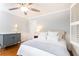 Comfortable bedroom with hardwood floors, ceiling fan, soft lighting, and ample space at 2197 Fairway Ne Cir, Brookhaven, GA 30319