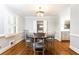 Charming dining room with hardwood floors, elegant chandelier, and white trim at 2197 Fairway Ne Cir, Brookhaven, GA 30319