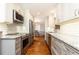 Modern kitchen with stainless steel appliances, granite countertops, and ample cabinet space at 2197 Fairway Ne Cir, Brookhaven, GA 30319