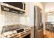 Modern kitchen features stainless steel appliances, granite countertops, and stylish backsplash at 2197 Fairway Ne Cir, Brookhaven, GA 30319