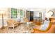 Open-concept living room flows into dining area, featuring hardwood floors and inviting decor at 2197 Fairway Ne Cir, Brookhaven, GA 30319