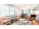 Spacious living room with hardwood floors, elegant decor, and windows with plantation shutters at 2197 Fairway Ne Cir, Brookhaven, GA 30319